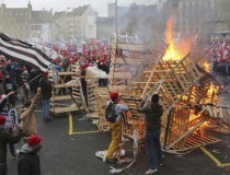 Protesters wearing red caps, the symbol of protest in the region, take part in a demonstration to maintain jobs in Quimper