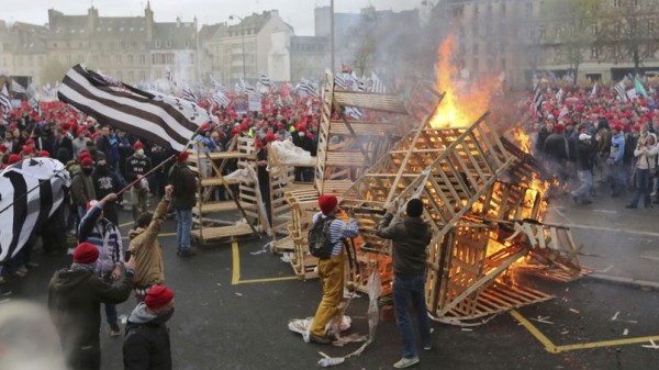 Protesters wearing red caps, the symbol of protest in the region, take part in a demonstration to maintain jobs in Quimper