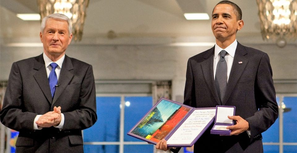 Nobel Committee Chairman Thorbjorn Jagland presents President Barack Obama with the Nobel Prize medal and diploma during the Nobel Peace Prize ceremony in Raadhuset Main Hall at Oslo City Hall in Oslo, Norway, Dec. 10, 2009. (Official White House Photo by Samantha Appleton) This official White House photograph is being made available only for publication by news organizations and/or for personal use printing by the subject(s) of the photograph. The photograph may not be manipulated in any way and may not be used in commercial or political materials, advertisements, emails, products, promotions that in any way suggests approval or endorsement of the President, the First Family, or the White House.