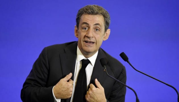 Nicolas Sarkozy, former French President and leader of France's main opposition right-wing "Les Republicains" party, (formerly known as UMP), gestures as he gives a speech during a welcoming meeting for new members of the party, on June 13, 2015, in Paris. AFP PHOTO / ALAIN JOCARD